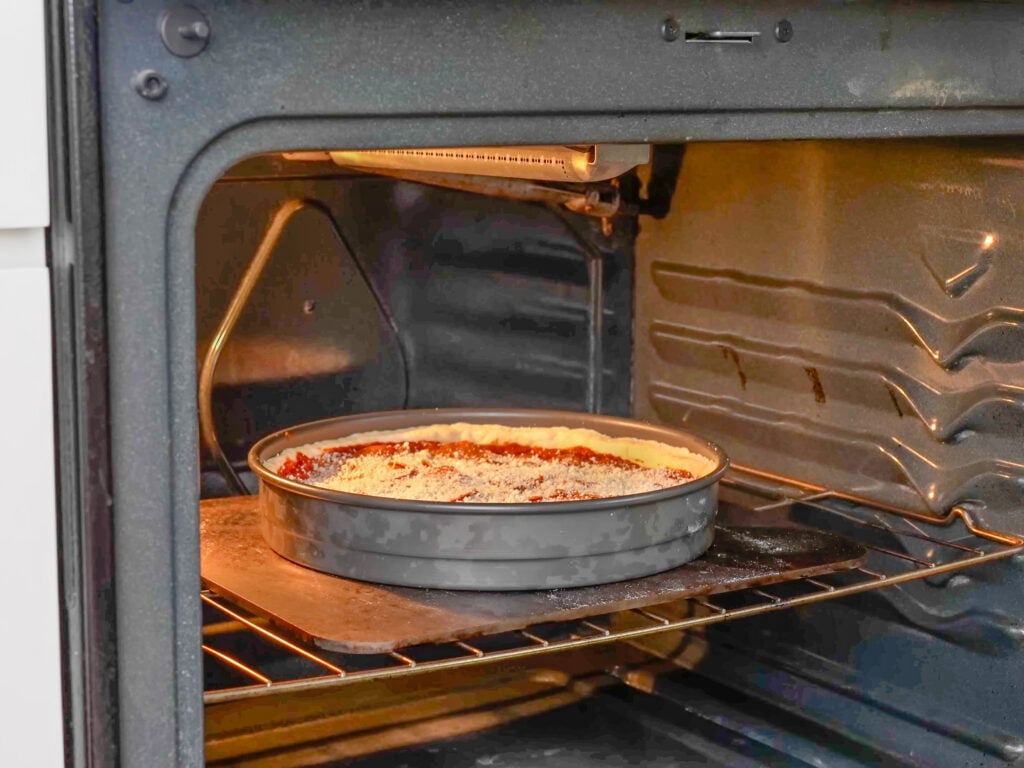 deep dish pepperoni pizza in oven