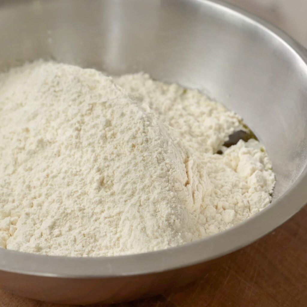 flour and water in silver bowl
