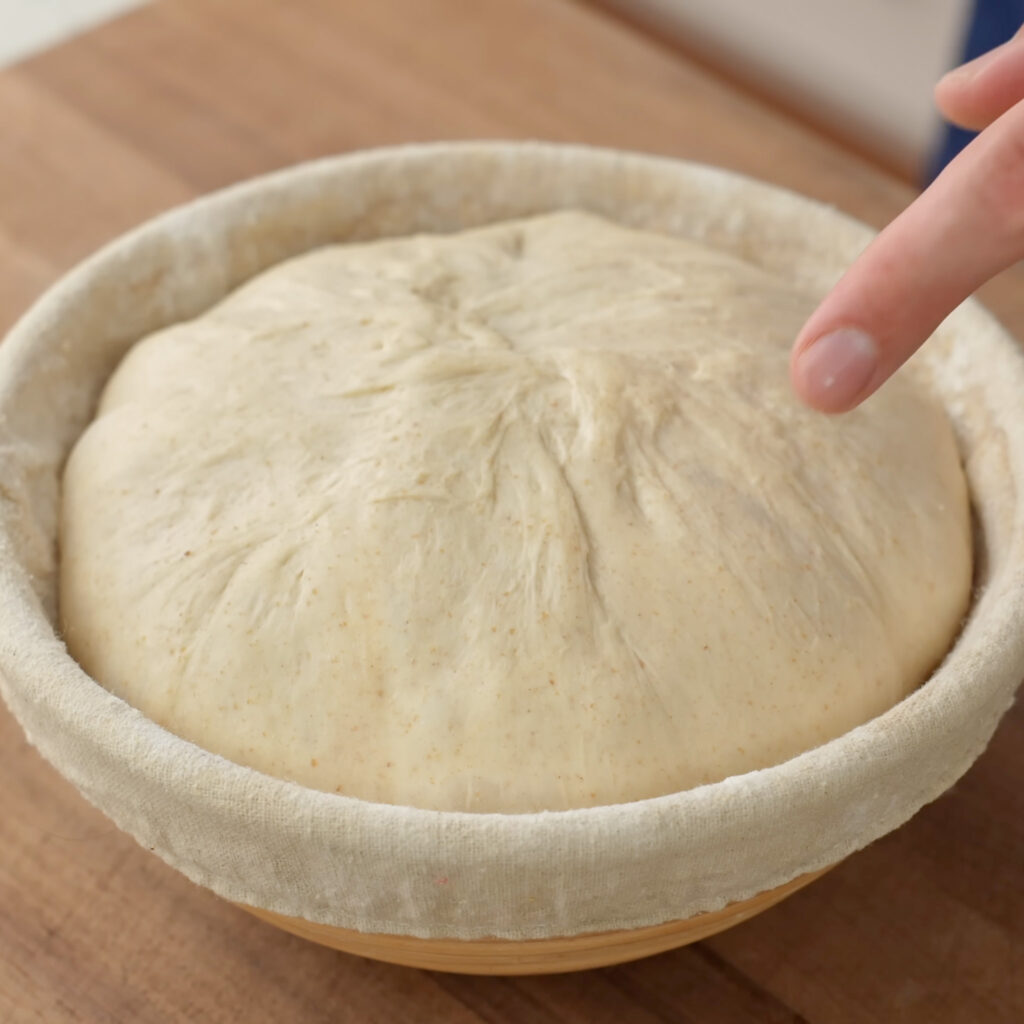 shaped and proofed boule dough in proofing basket
