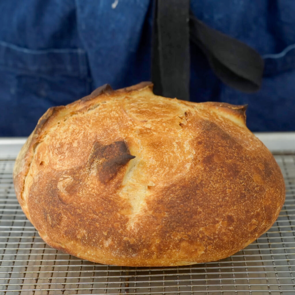 sourdough boule on wire rack
