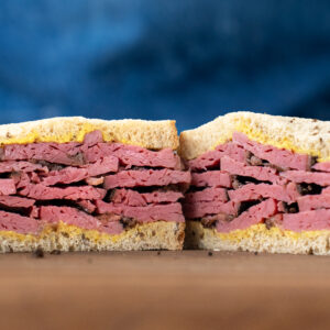 pastrami on rye sandwich with blue apron