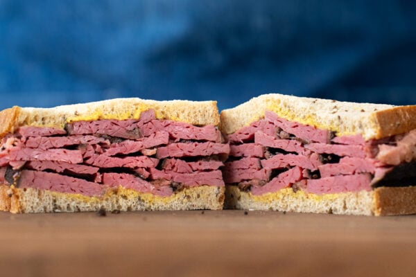 pastrami on rye sandwich with blue apron