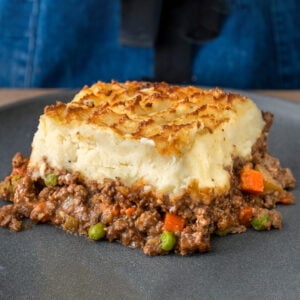 slice of shepherd's pie on a grey plate