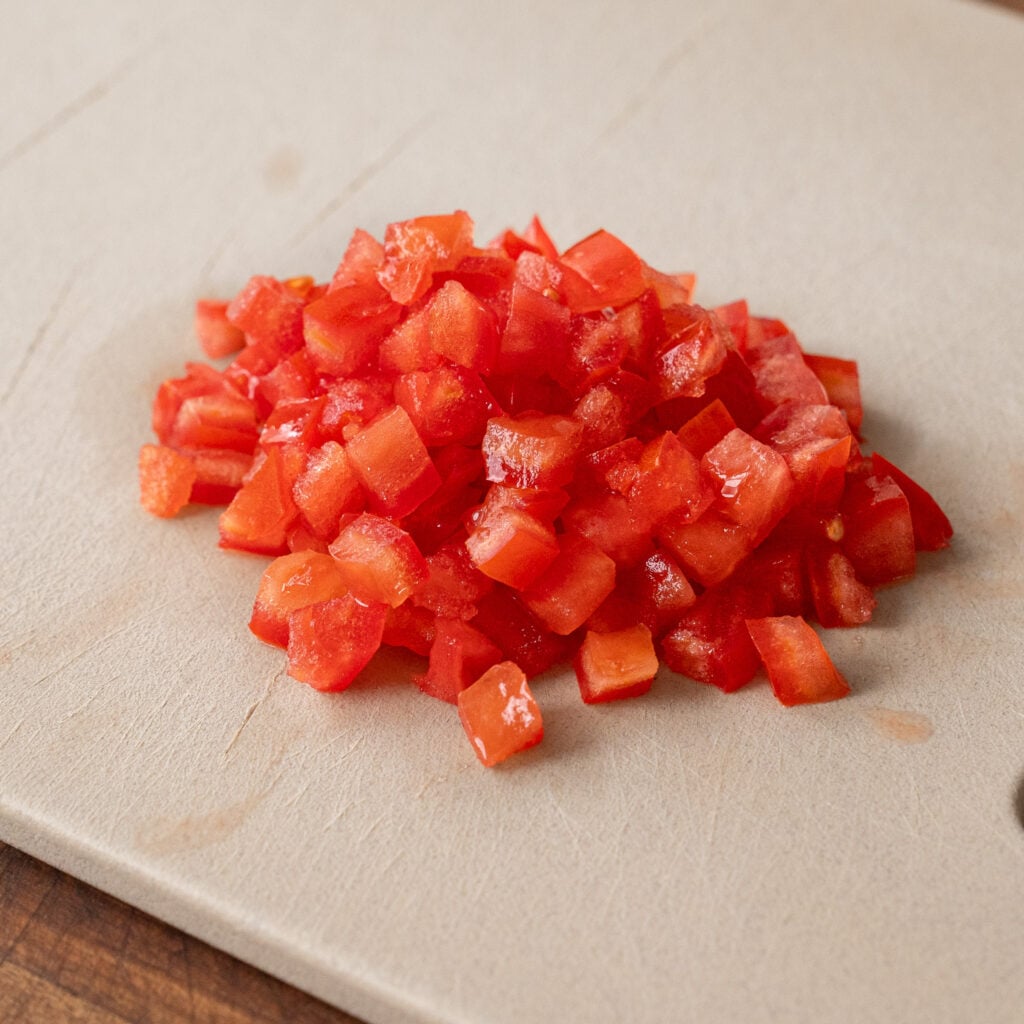 diced tomatoes on cutting board