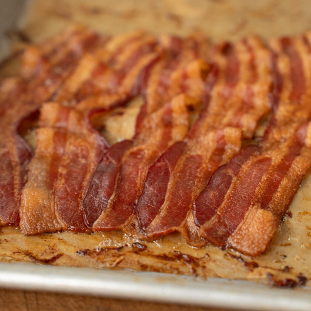 strips of rendered browned bacon