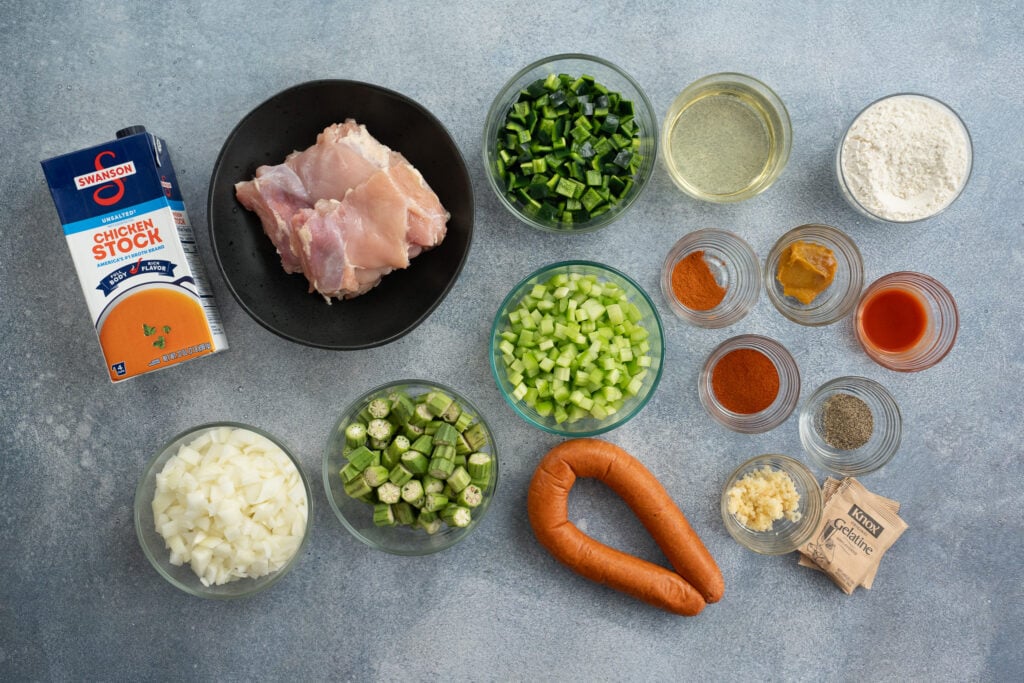 gumbo ingredients on a grey background