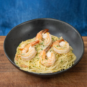 shrimp scampi with angel hair pasta in a black bowl