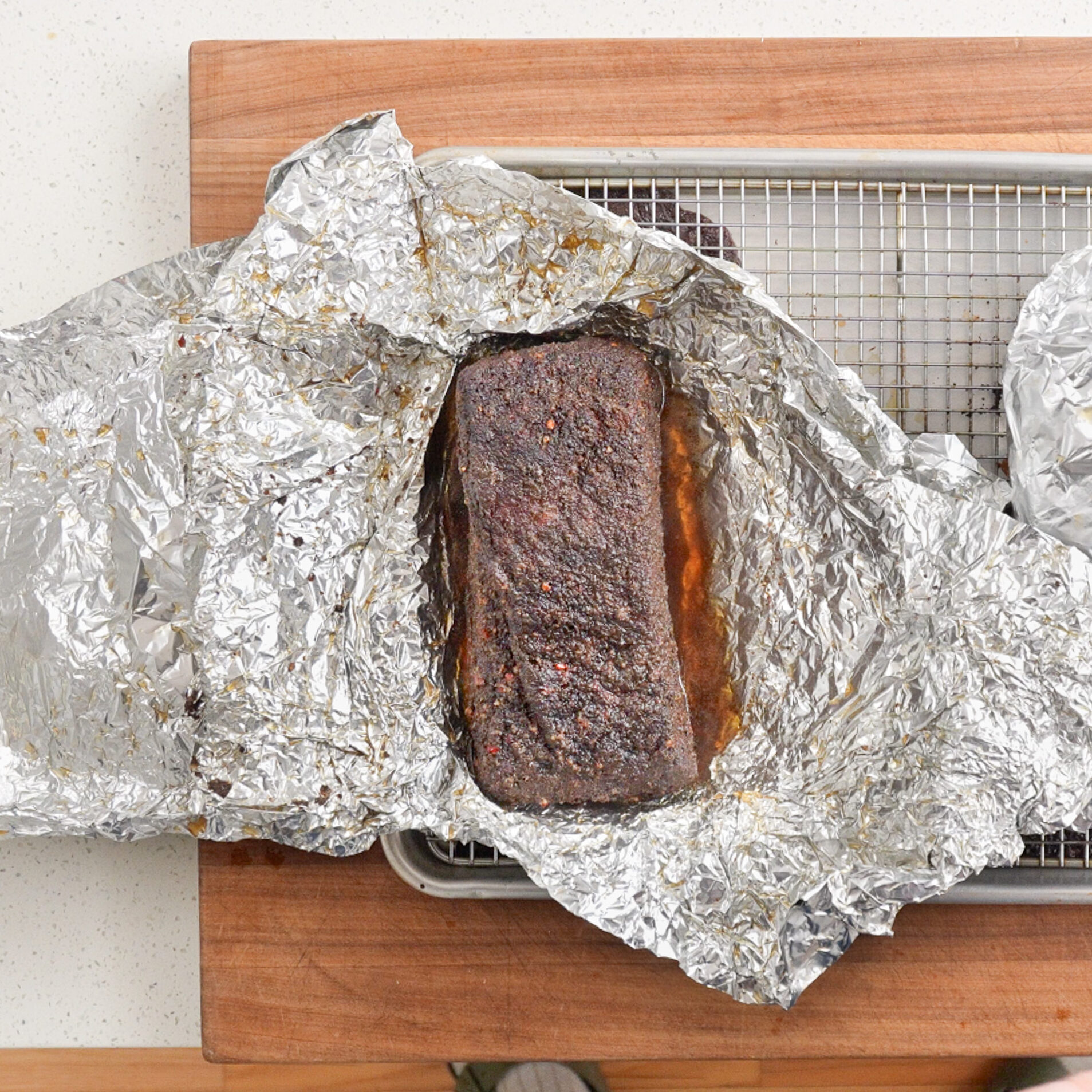 unwrapped baked pastrami on foil
