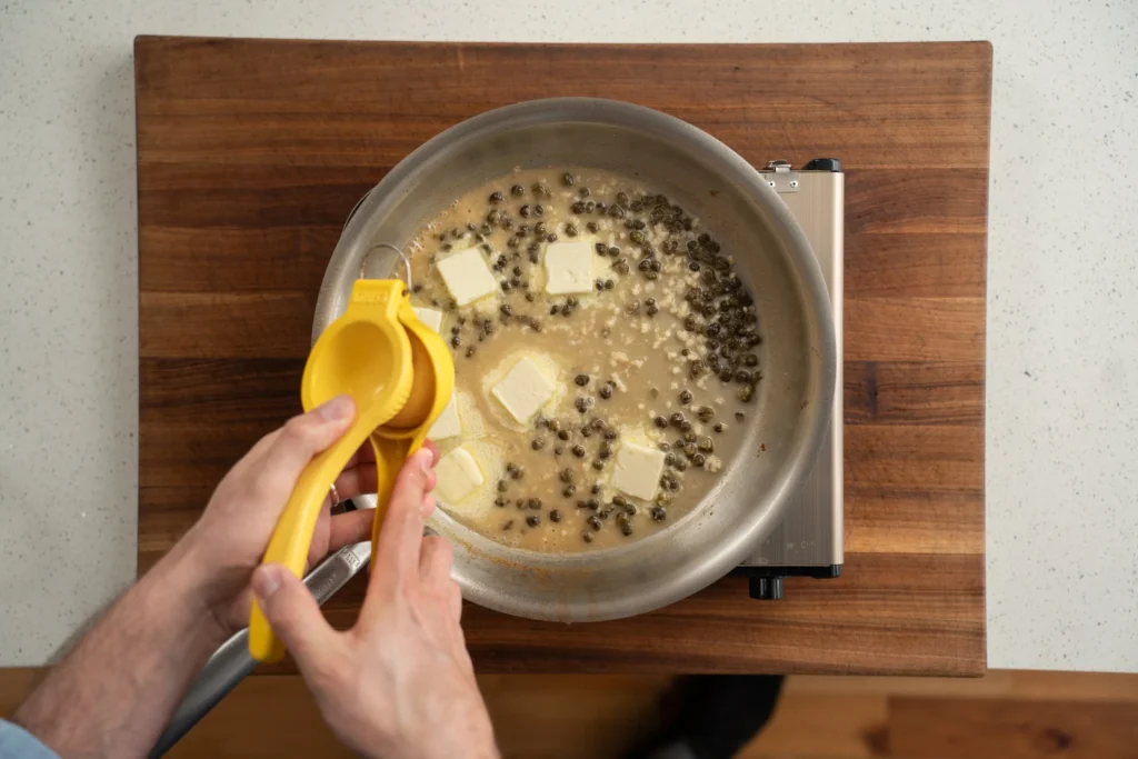 adding lemon juice to white wine butter sauce