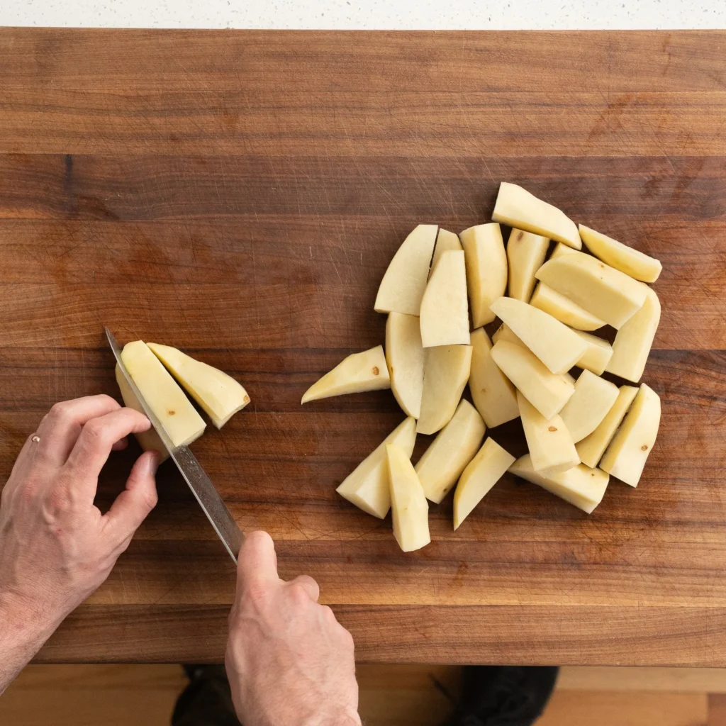 cutting potatoes into wedges