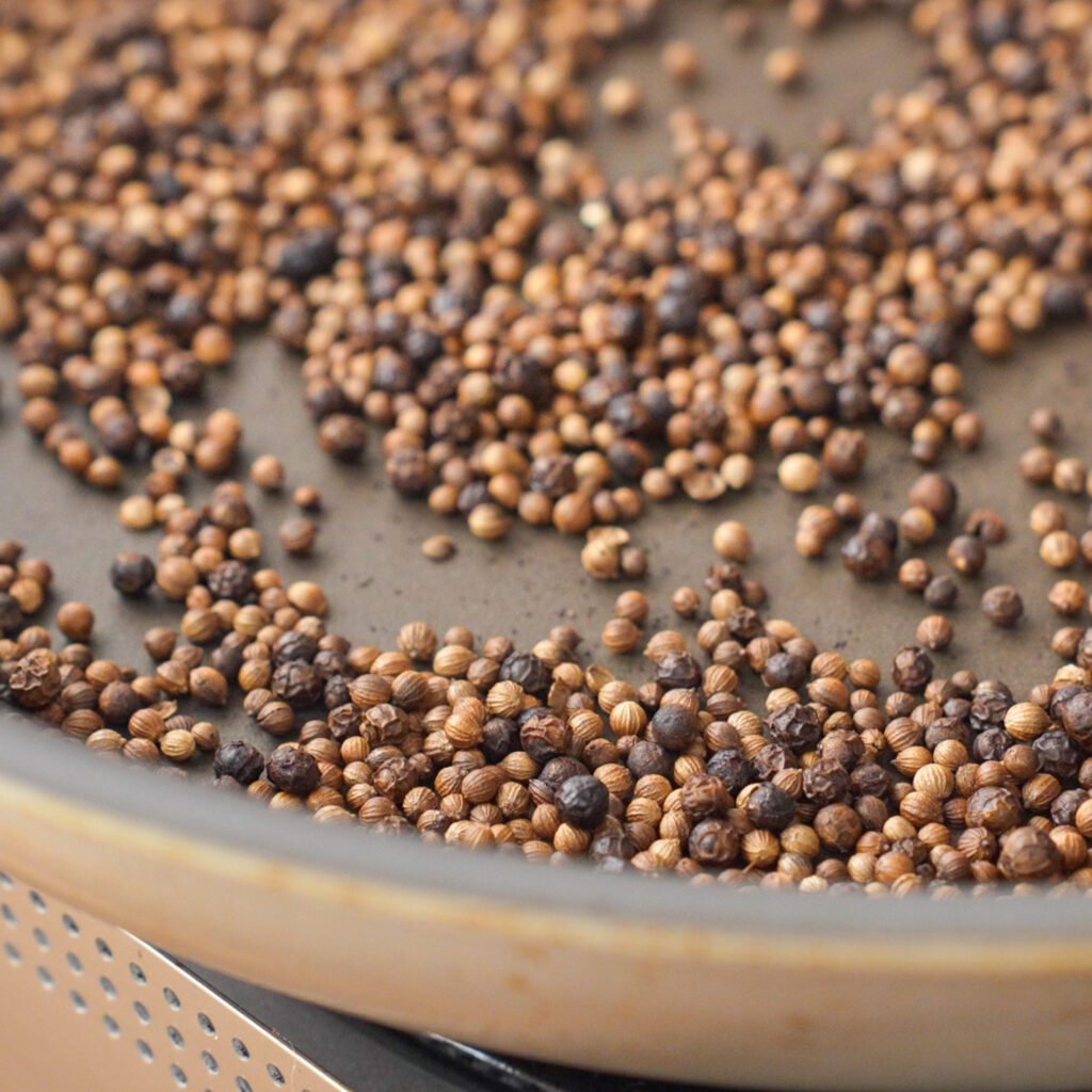 close up of toasted spices in nonstick pan