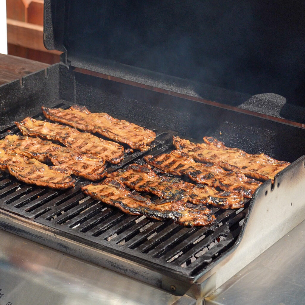 korean short ribs with grill marks on a grill