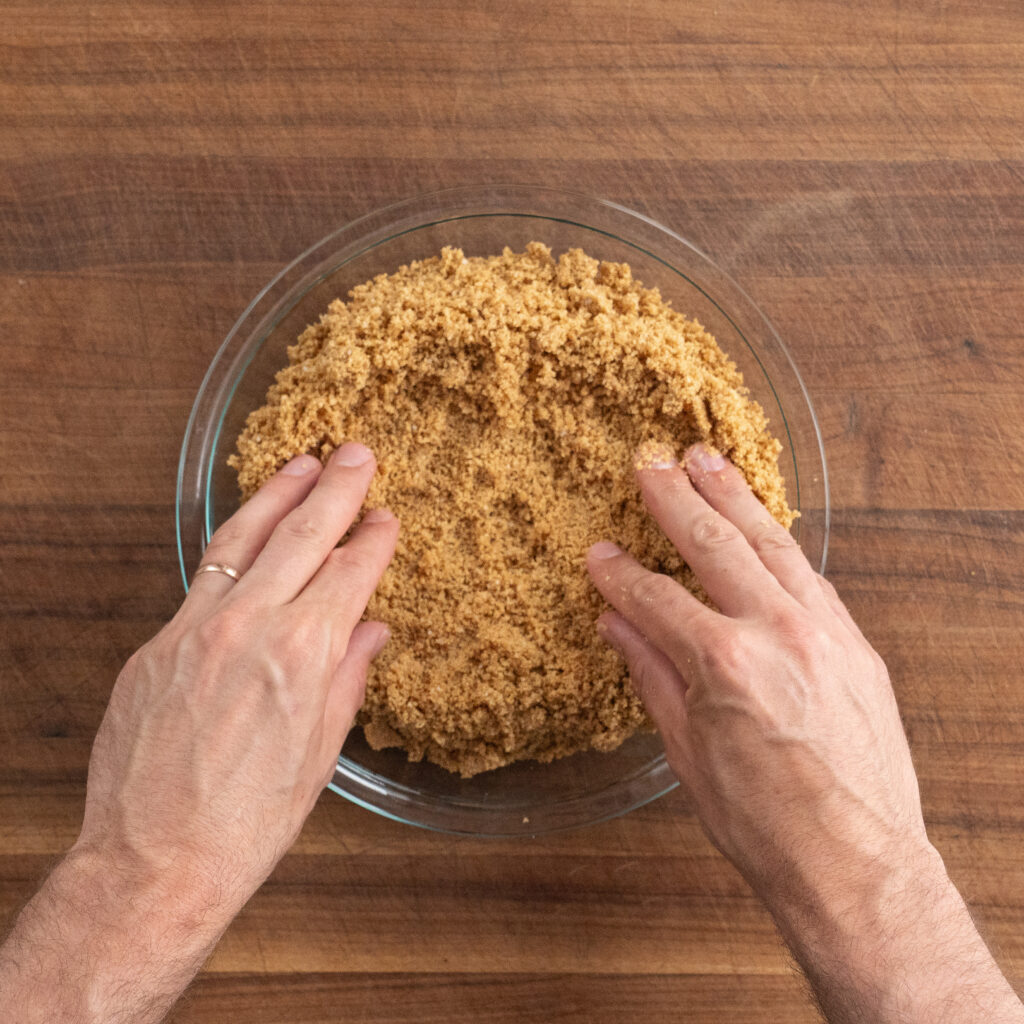 spreading graham cracker crust in pie plate