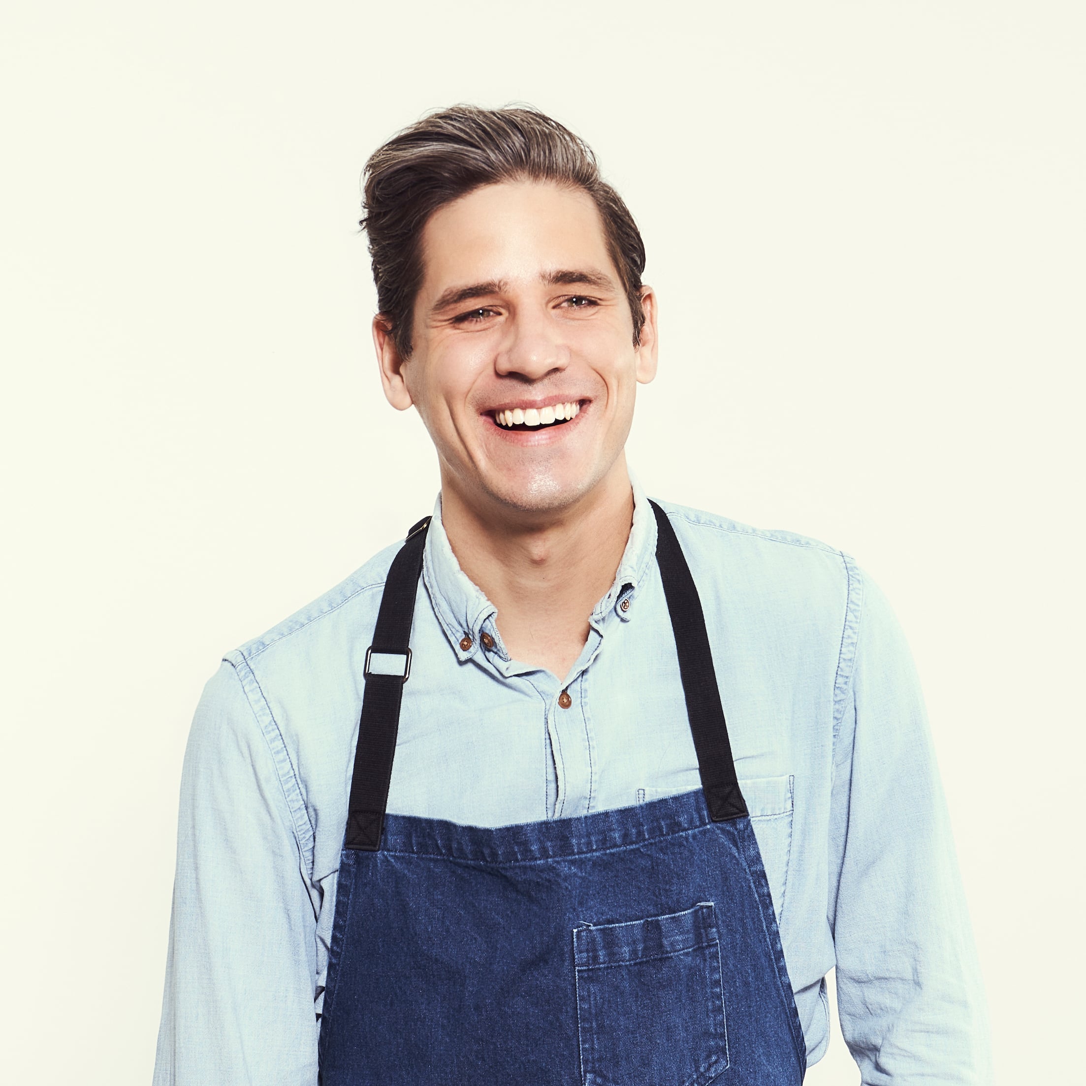Brian lagerstrom wearing apron laughing
