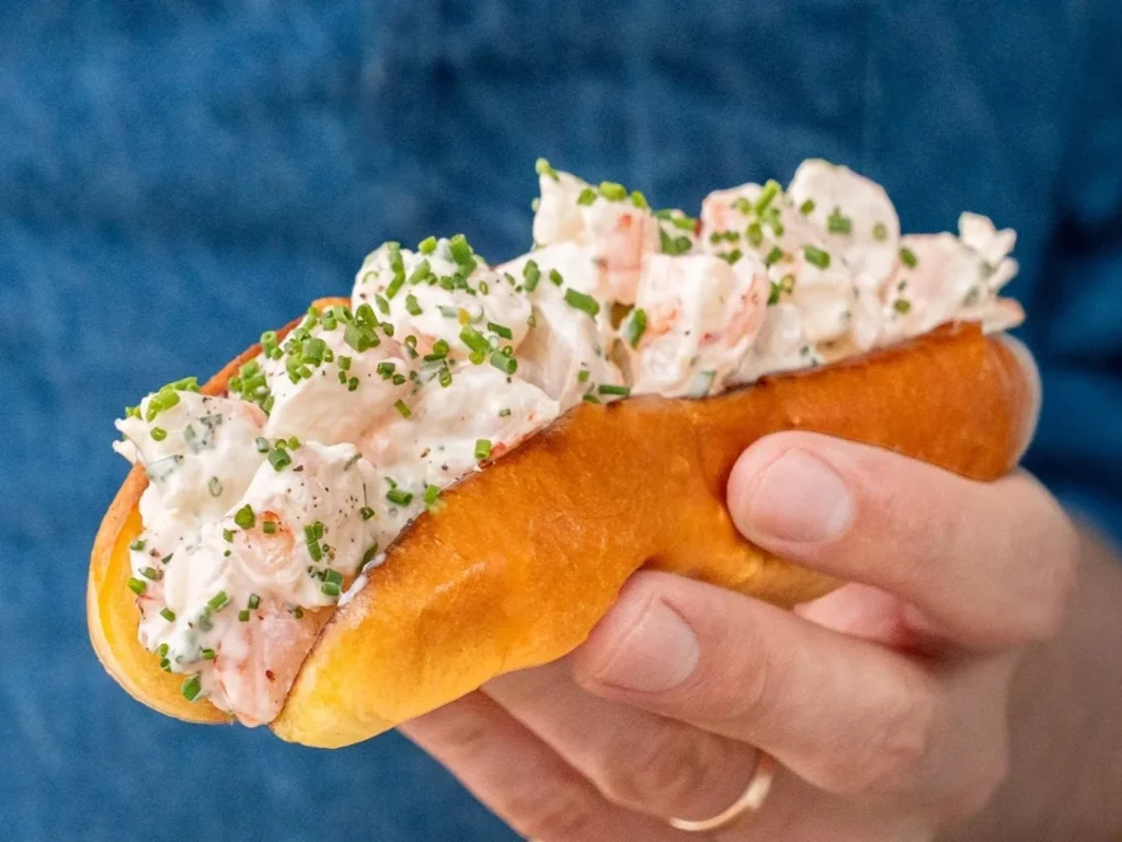 hand holding shrimp roll