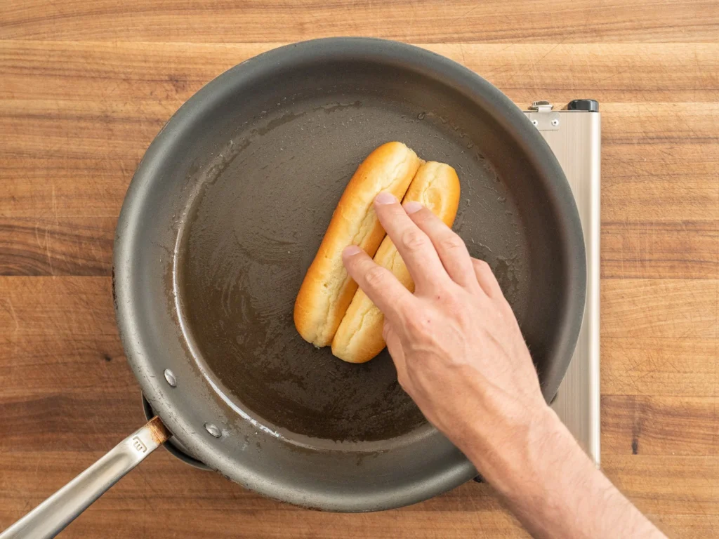 toasting hot dog bun in nonstick pan