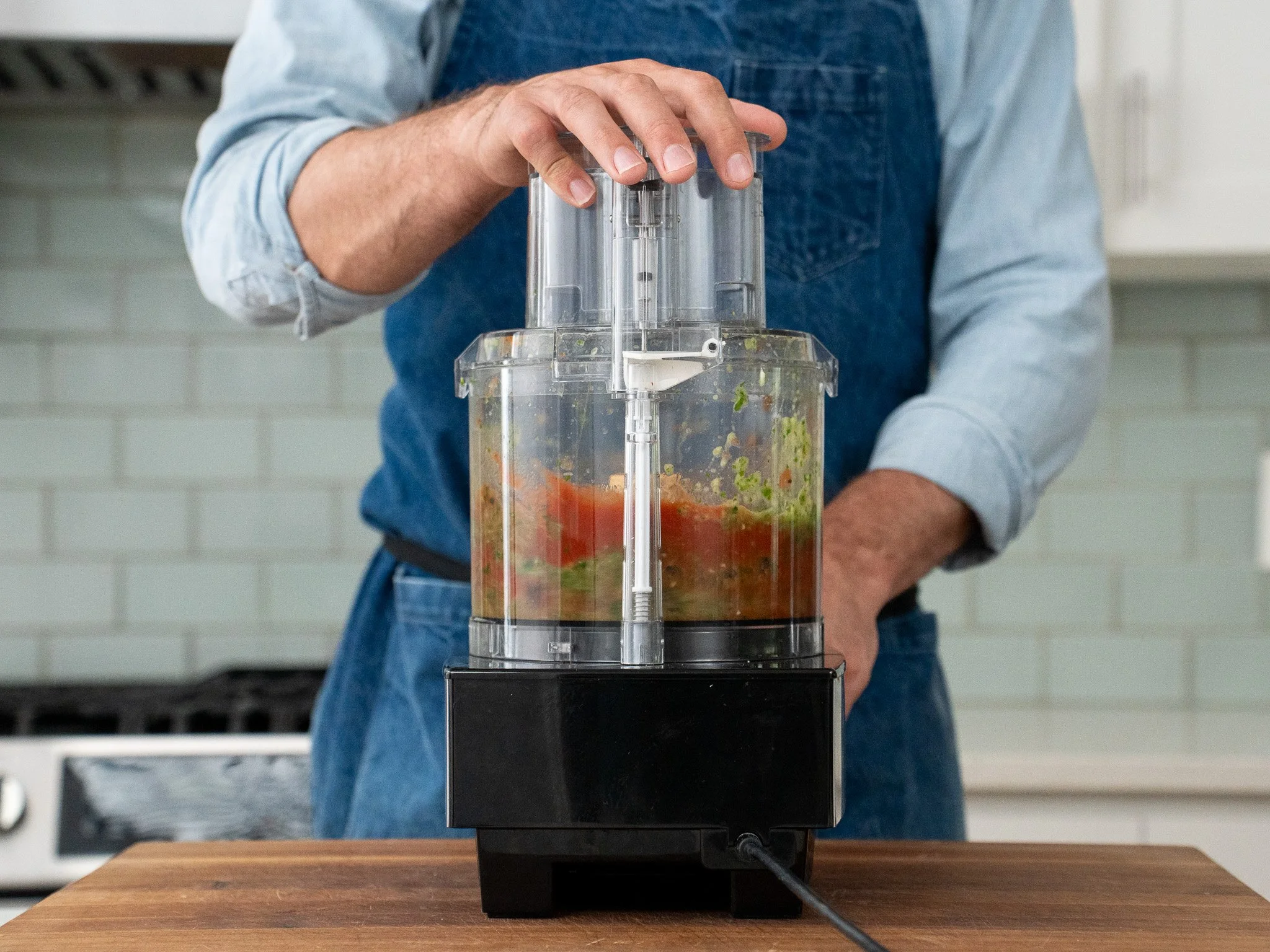 salsa ingredients being blended in food processor