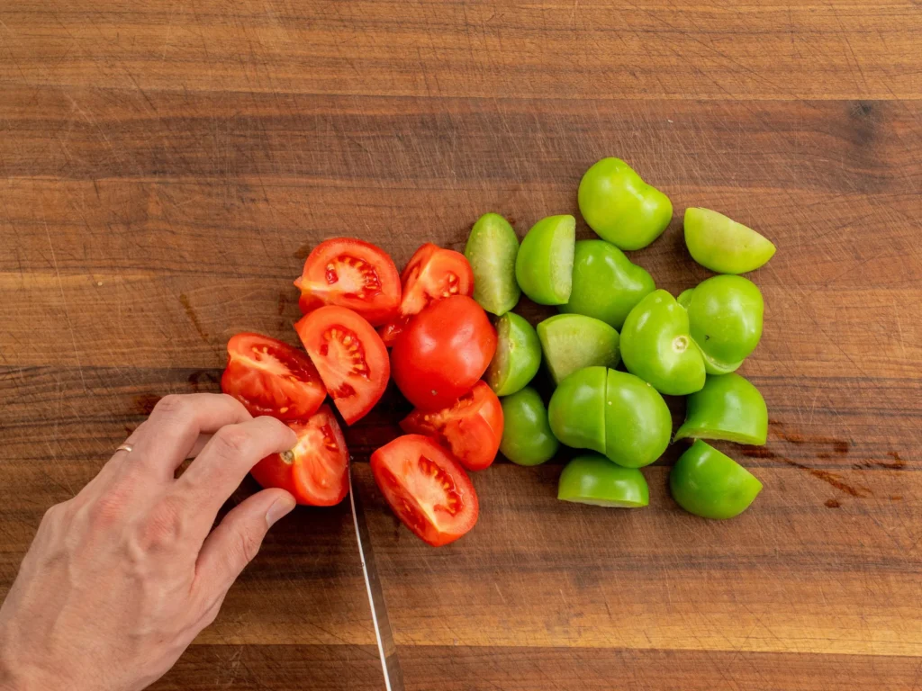 chopping tomatoes and tomatillos 
