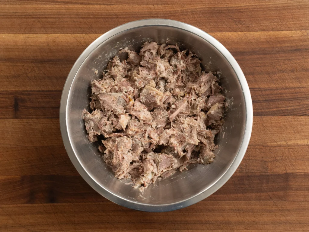pork carnitas in silver bowl