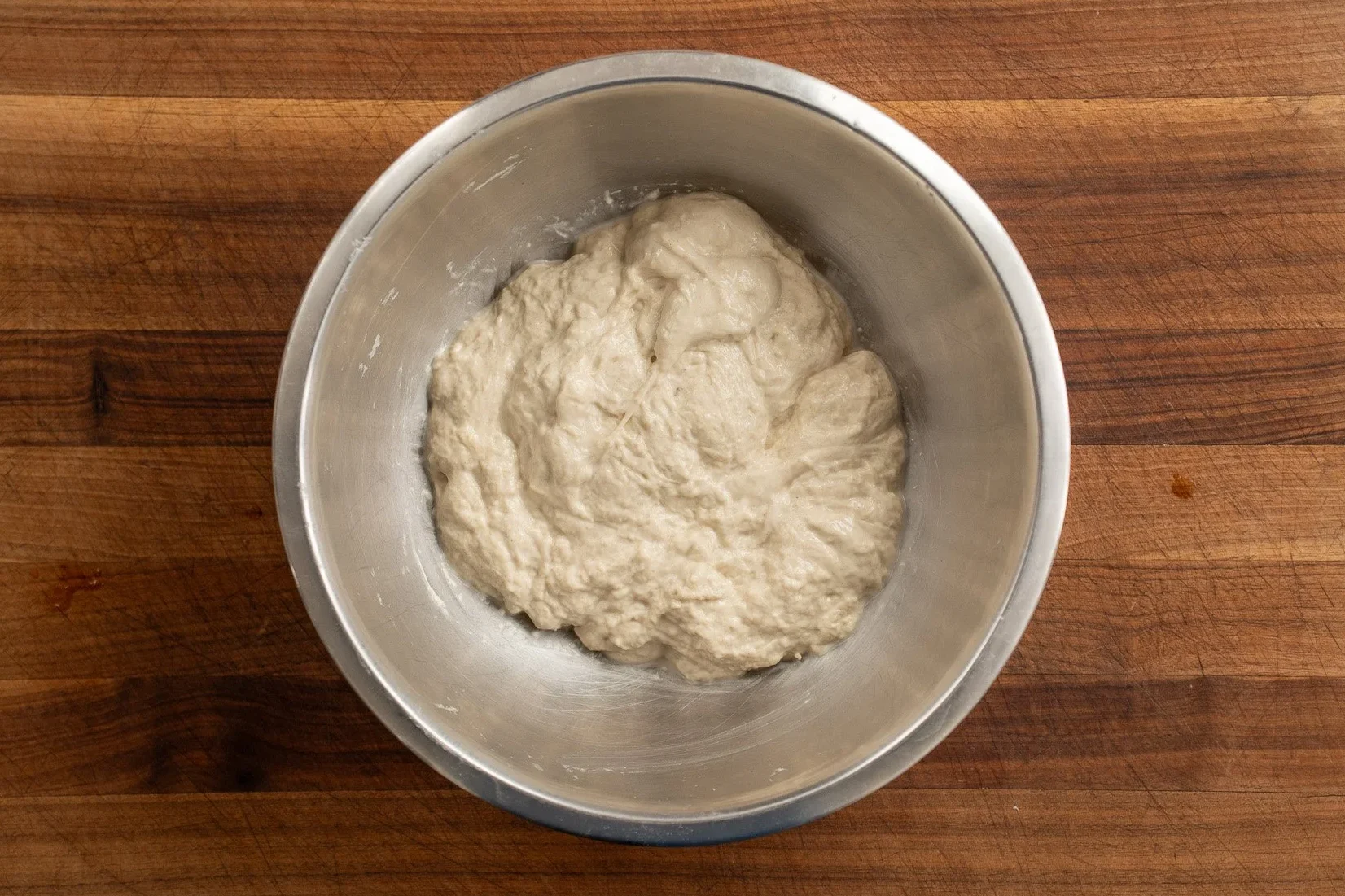 focaccia dough in a mixing bowl after first mix
