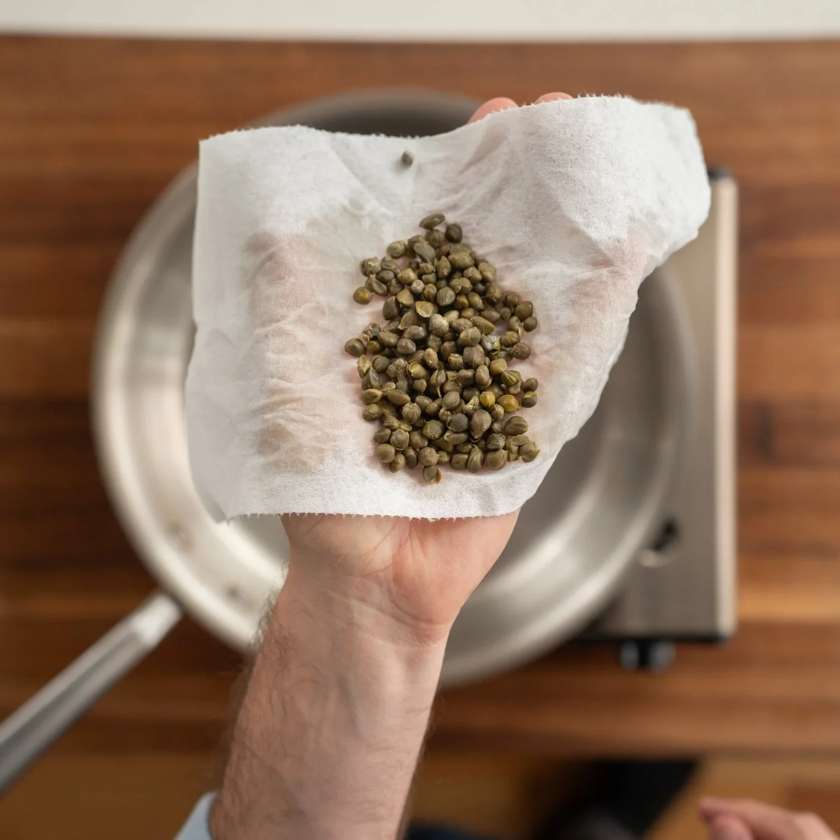 holding capers on a paper towel
