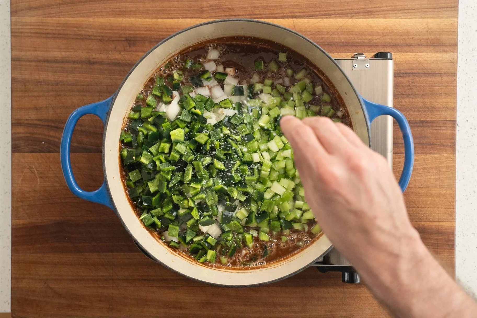 adding poblanos celery and onion into roux