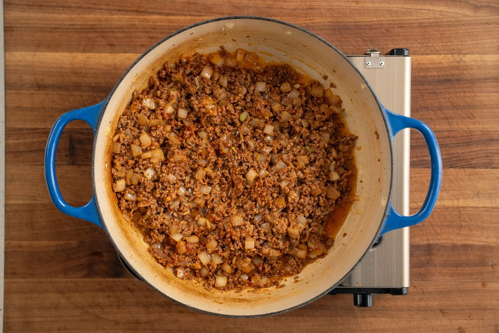 ground beef with cooked tomato paste
