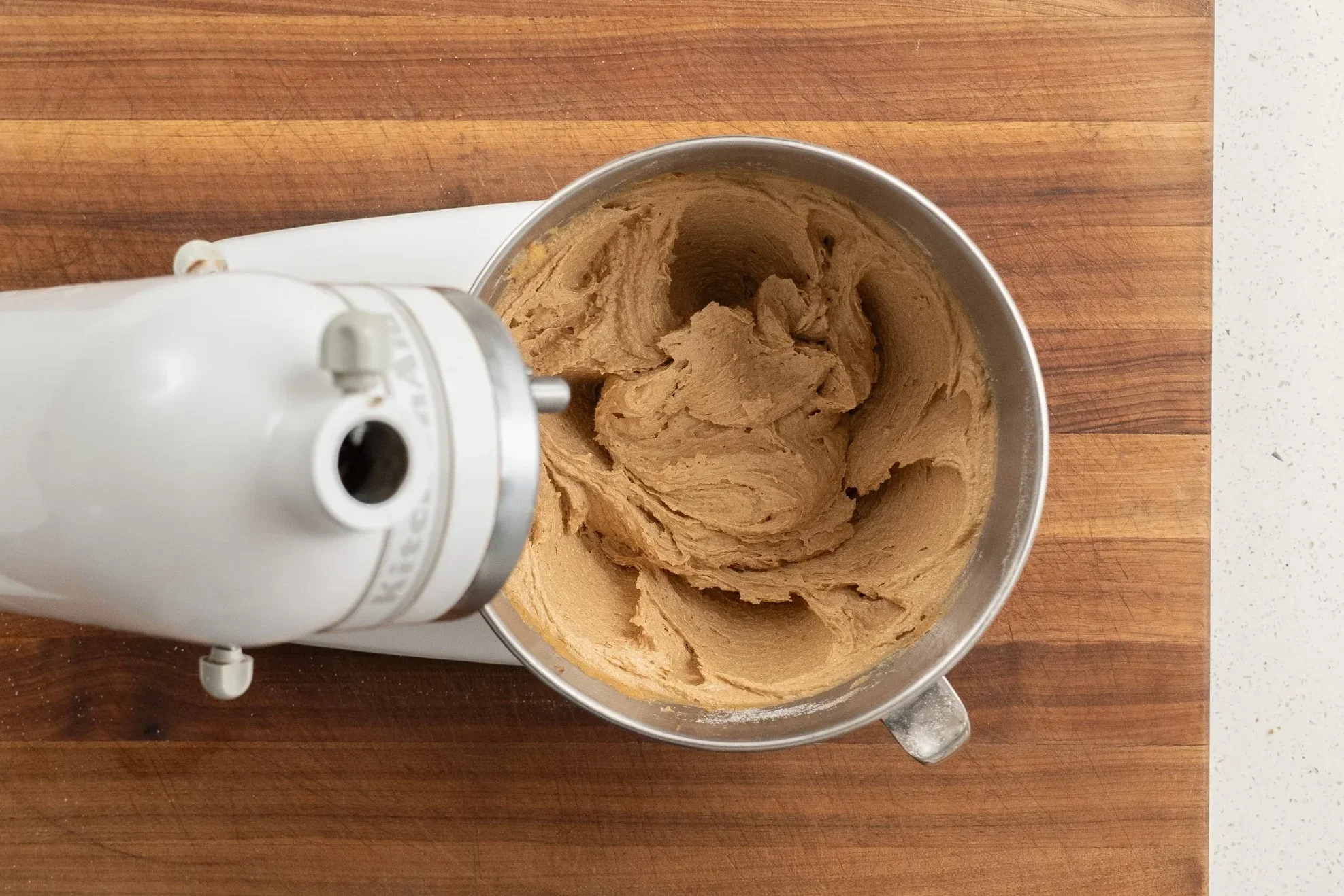 creamed peanut butter cookie ingredients in a stand mixer bowl