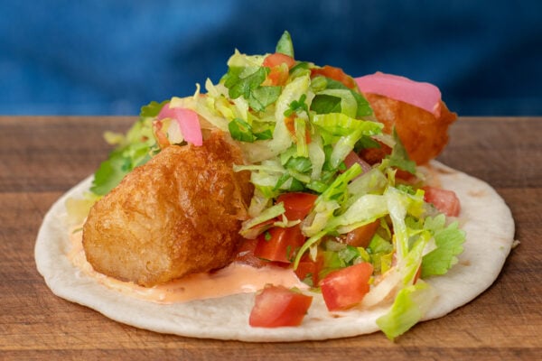 Baja Fish taco on cutting board