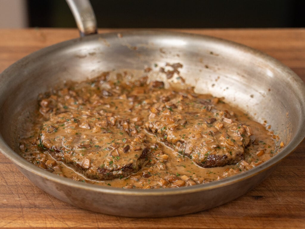steak diane in silver saute pan
