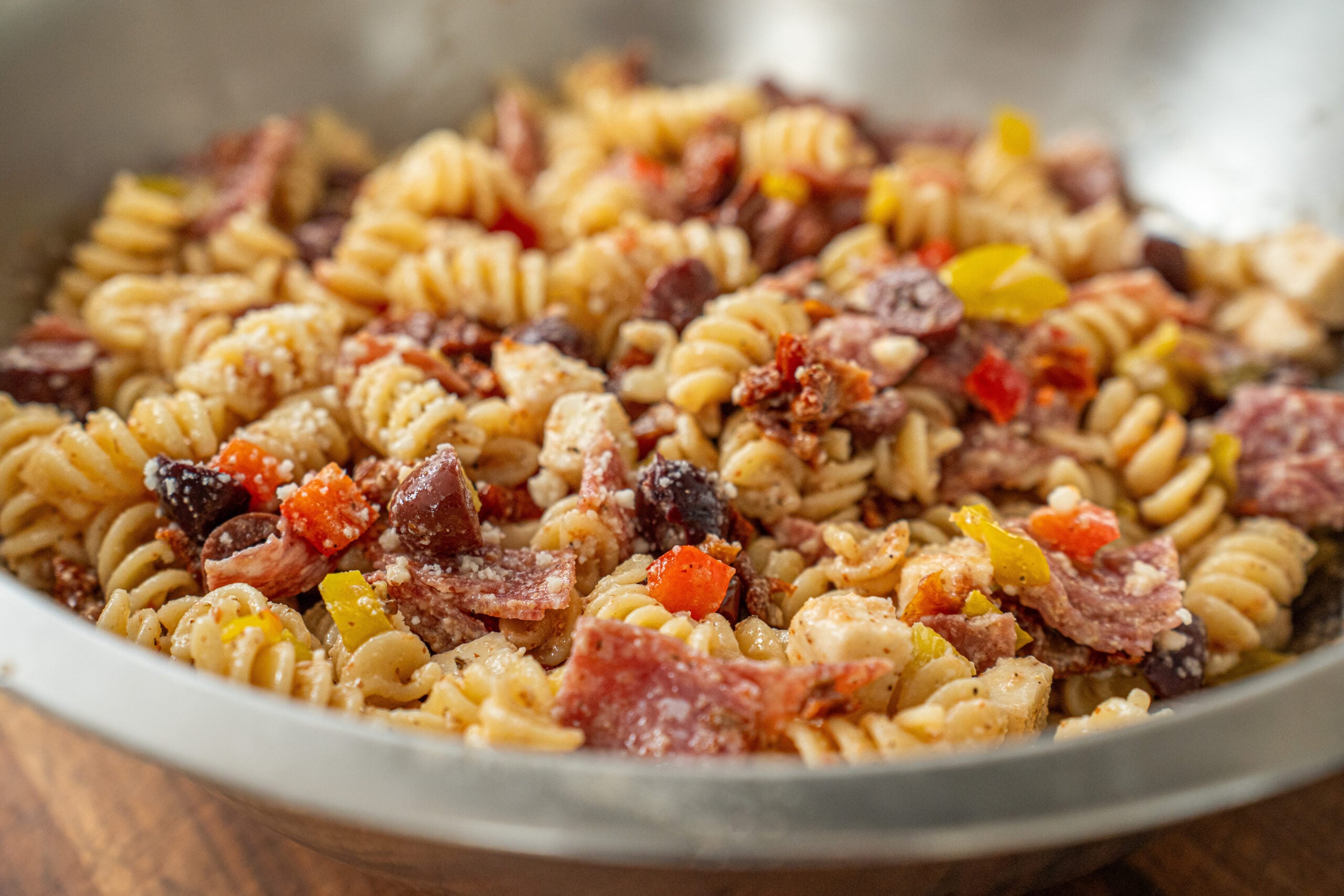 close up of Italian pasta salad in silver bowl