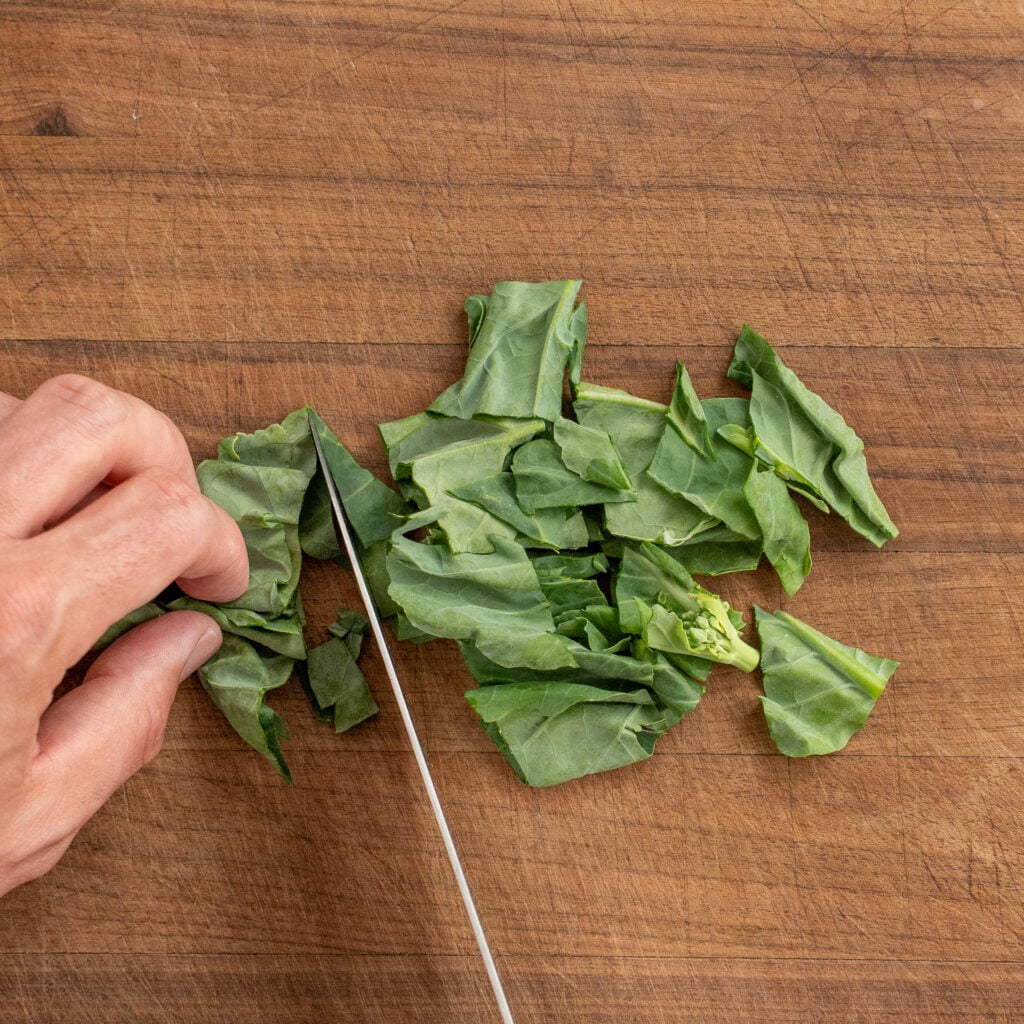 chopping Chinese broccoli leaves