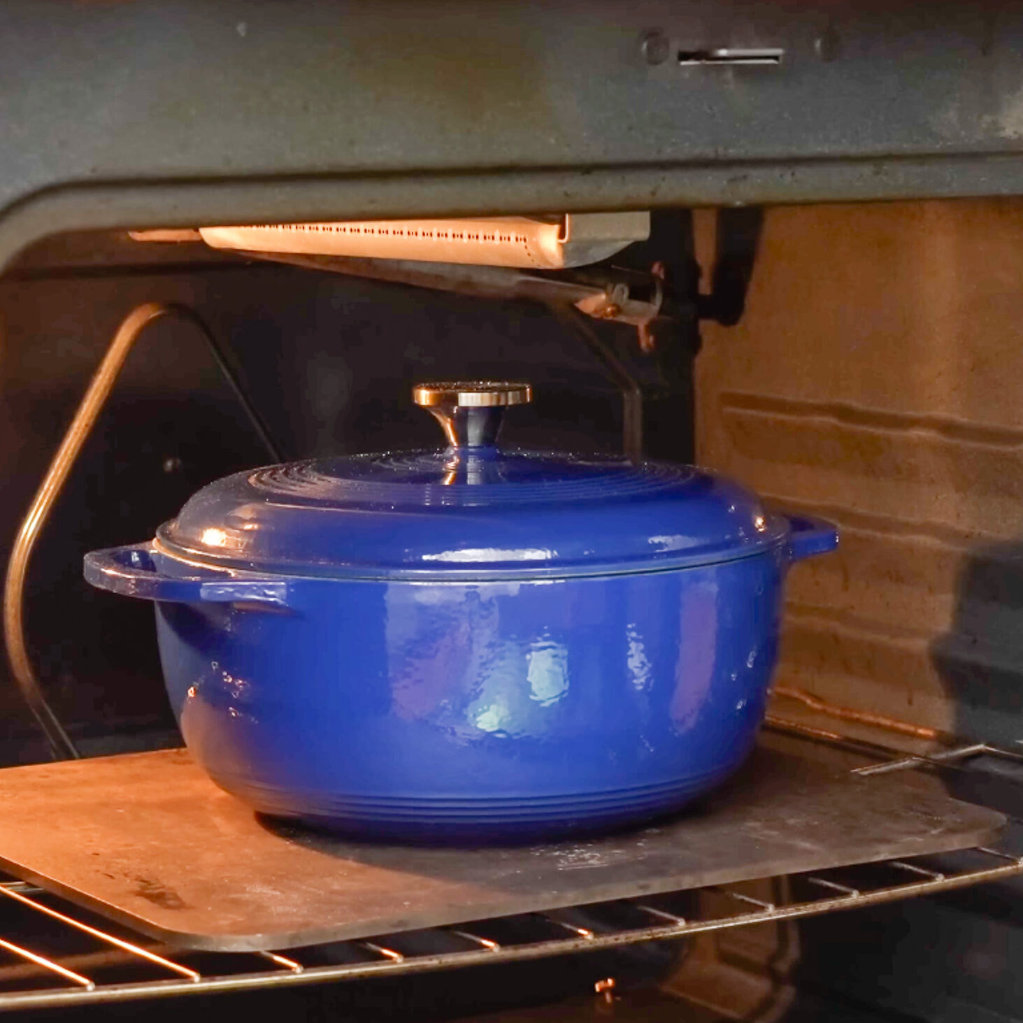 blue dutch oven in oven