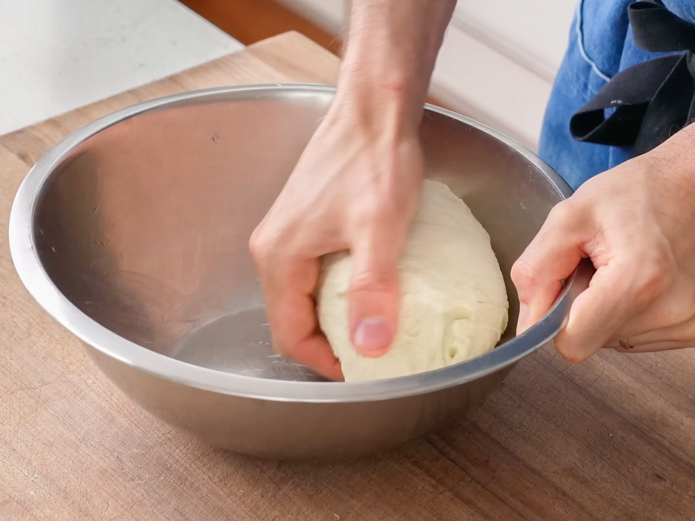 rounding pizza dough into ball