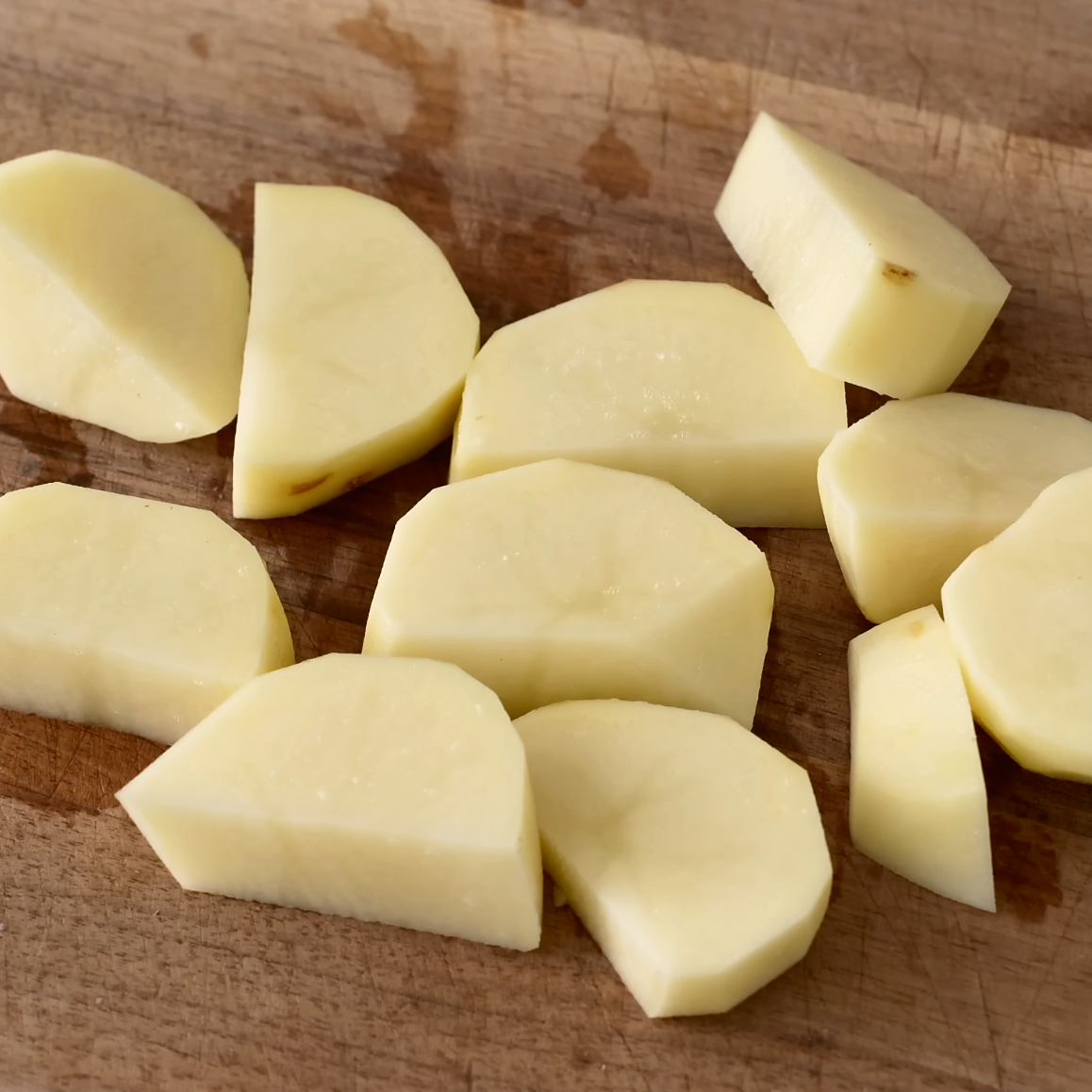 diced potatoes on wood cutting board