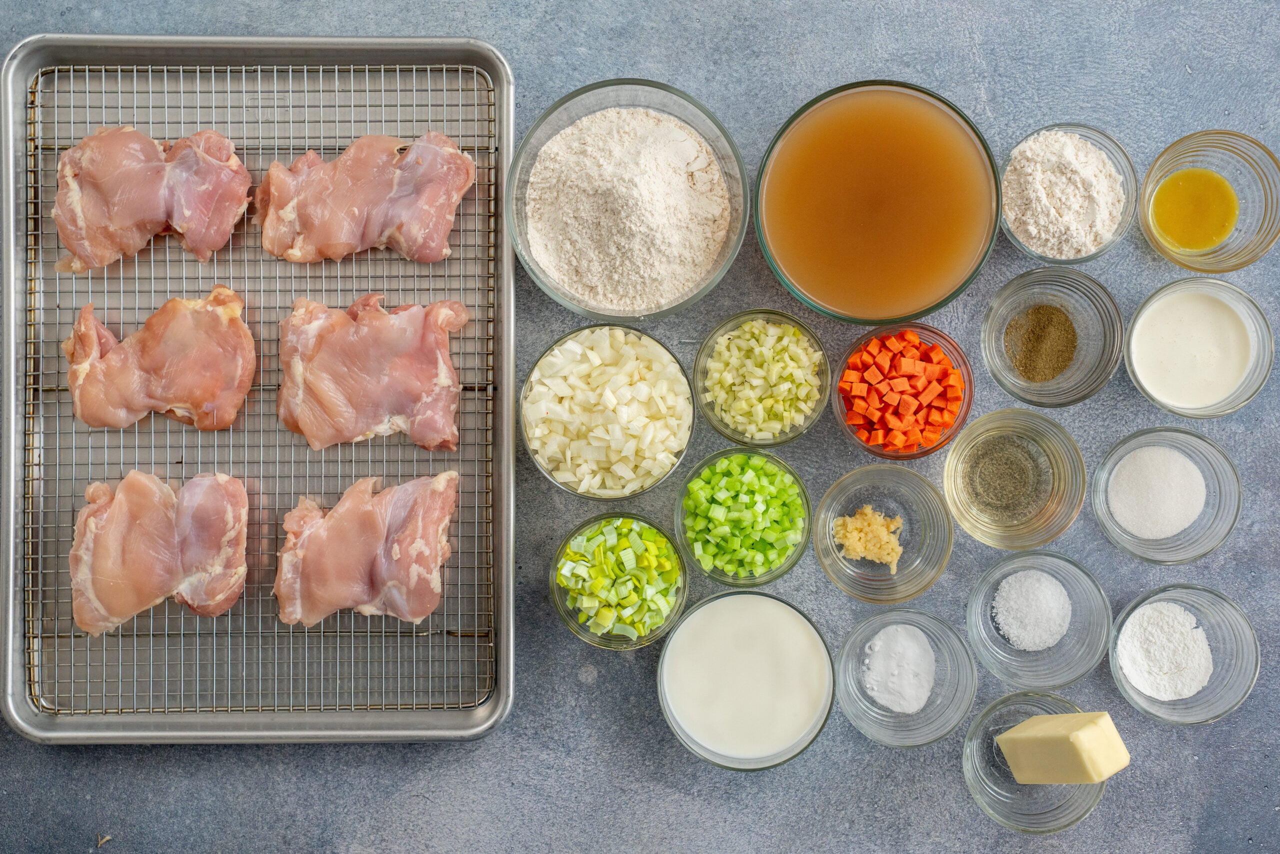 drop biscuit chicken pot pie ingredients displayed on a grey surface