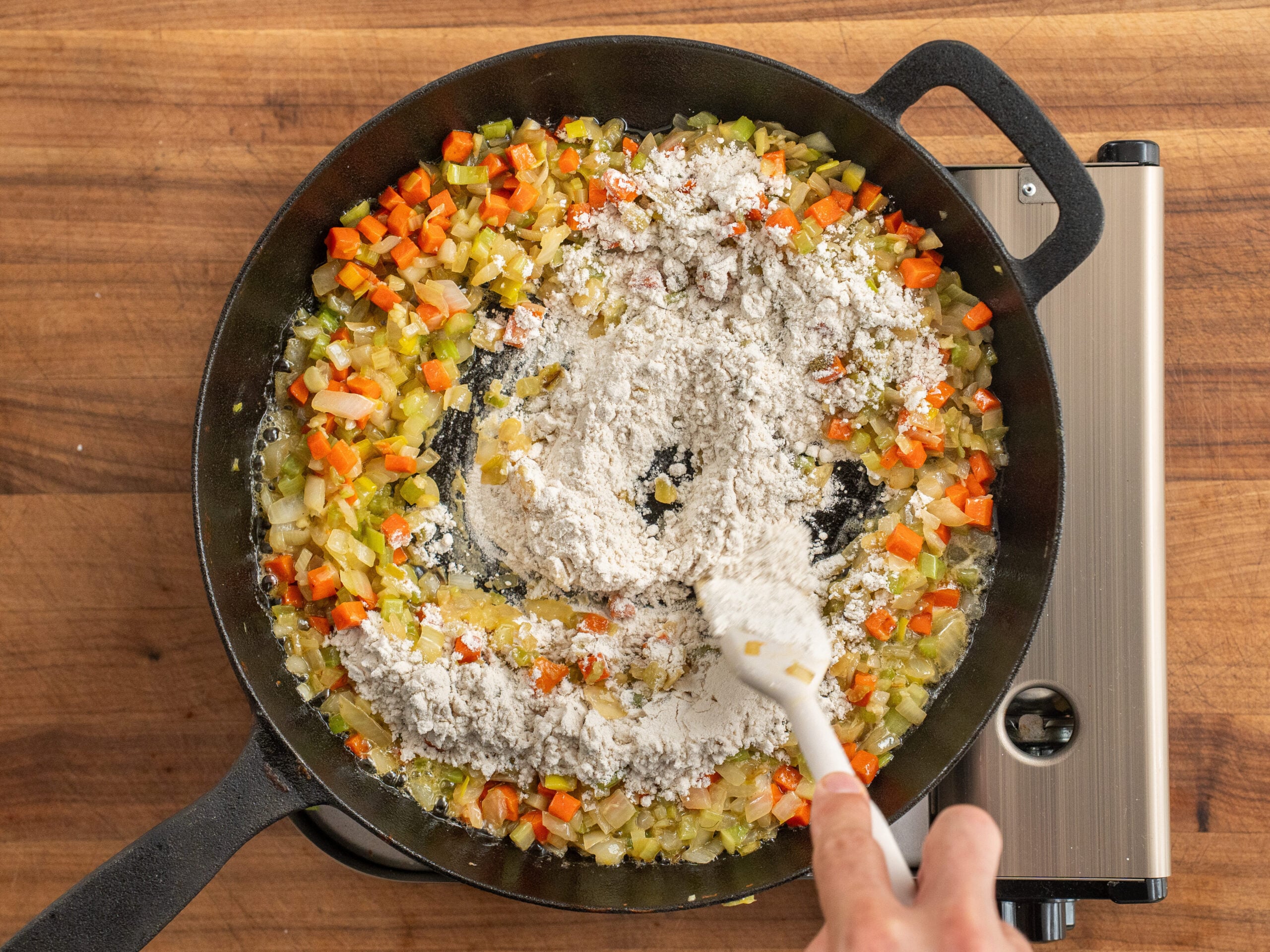 mixing flour into mirepoix