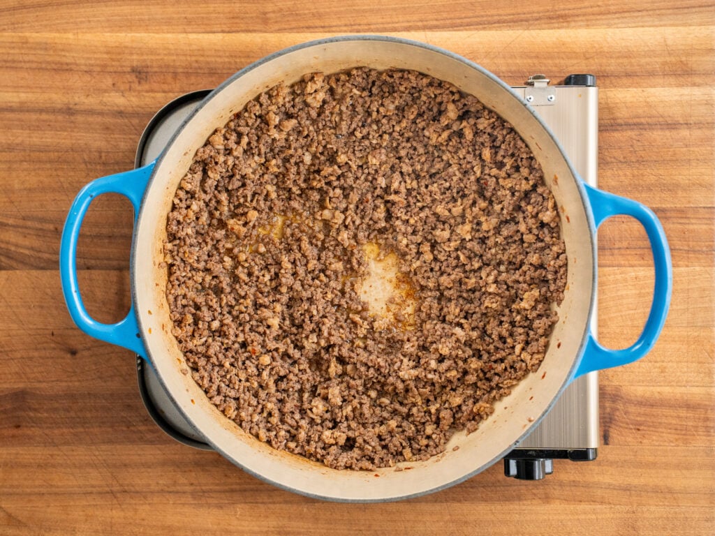 cooked ground beef in blue dutch oven